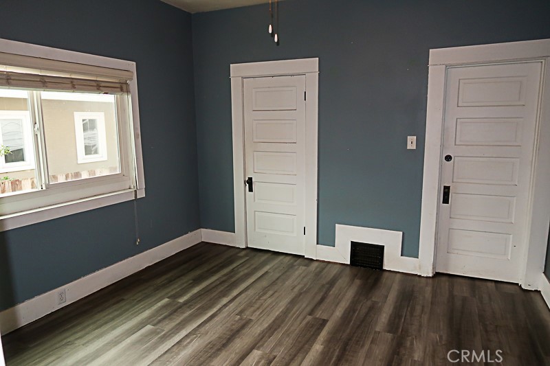 1239 Broadway Street Chico, CA 95928 - Photo 21 of 36 wooden floor in an empty room with a window