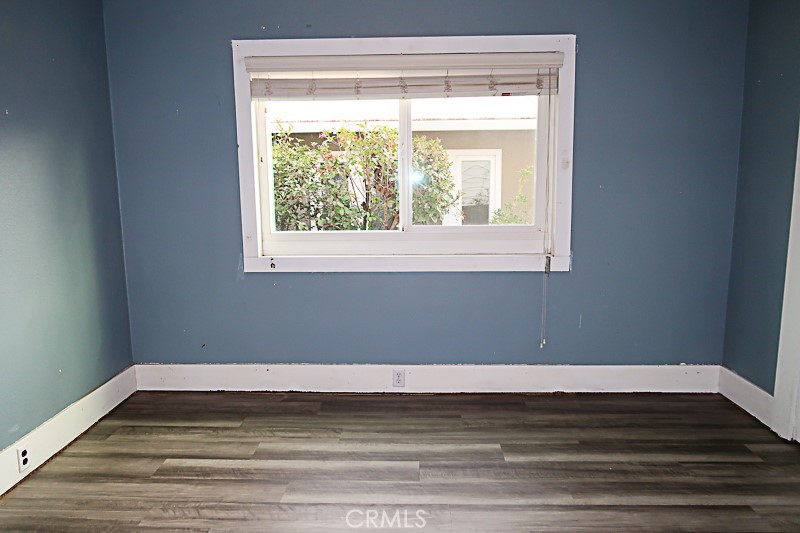 1239 Broadway Street Chico, CA 95928 - Photo 22 of 36 a view of a room with wooden floor and a window