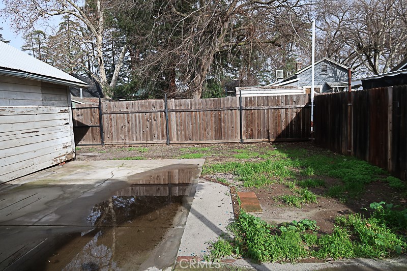 1239 Broadway Street Chico, CA 95928 - Photo 32 of 36 a view of a backyard with wooden fence