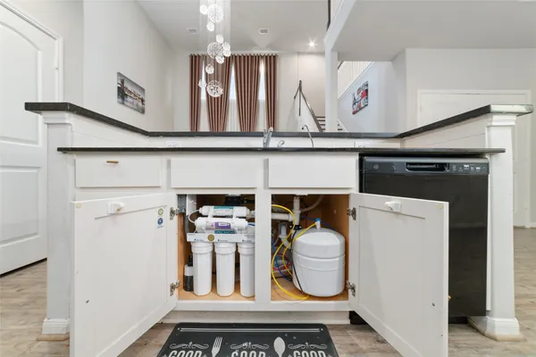 a view of an entryway with wooden floor