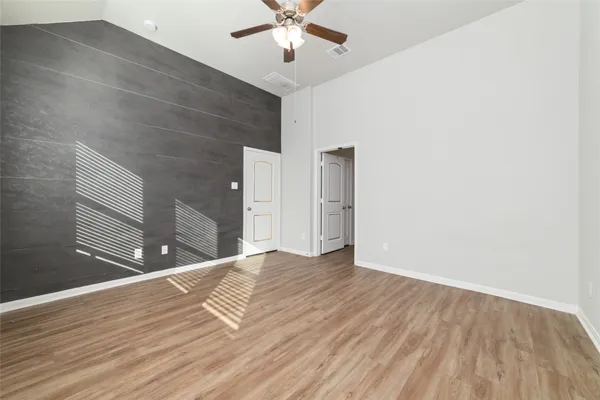 a bathroom with a tub shower and sink