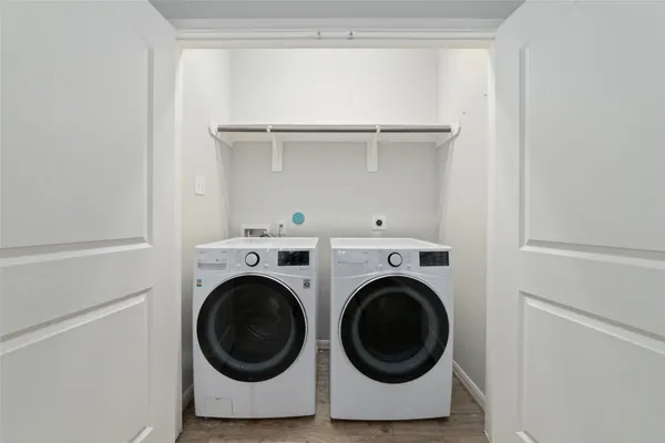 a bathroom with a sink a toilet a mirror a bathtub and shower