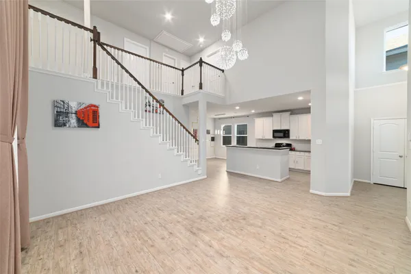 a view of kitchen with cabinets and wooden floor