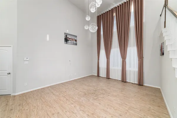 a kitchen with a sink stainless steel appliances and white cabinets