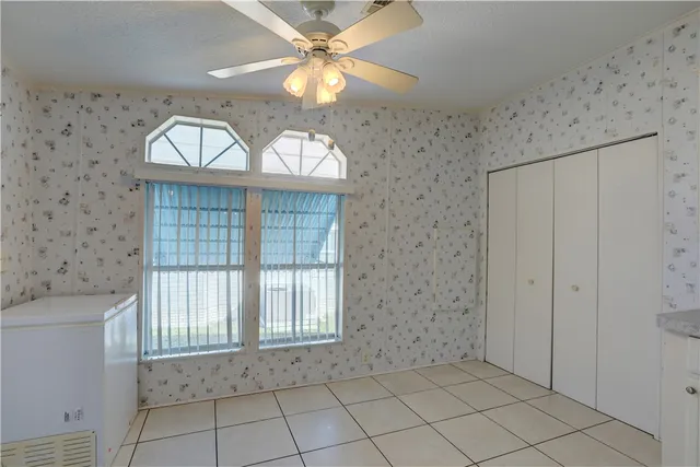 a kitchen with stainless steel appliances granite countertop a stove a refrigerator and a sink