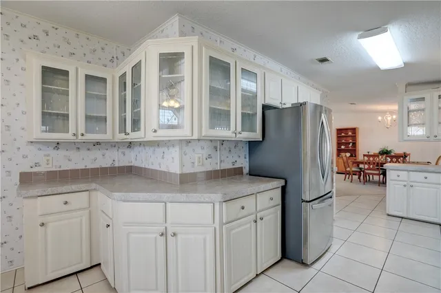 a kitchen with a sink and cabinets
