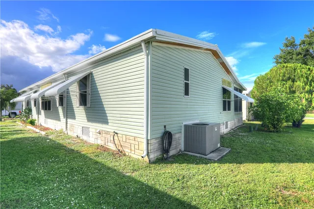 a front view of house with a garden