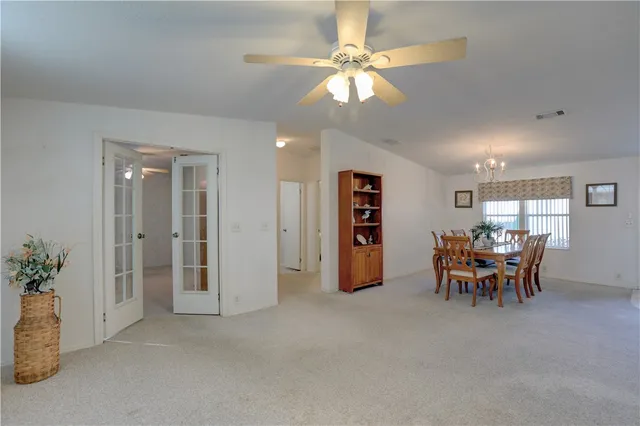 a view of a livingroom with furniture and a window