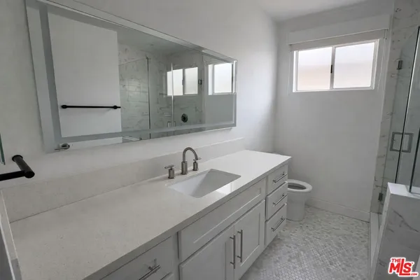 a bathroom with a sink and a toilet