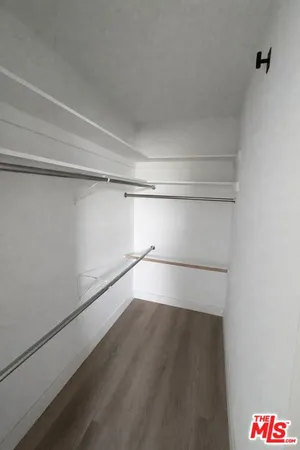 a view of an empty walk in closet
