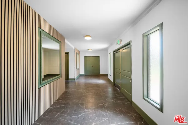 a view of gallery with windows