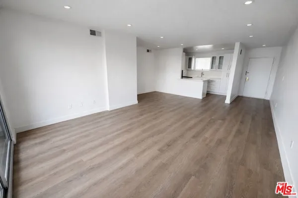 a view of kitchen with refrigerator stove and microwave