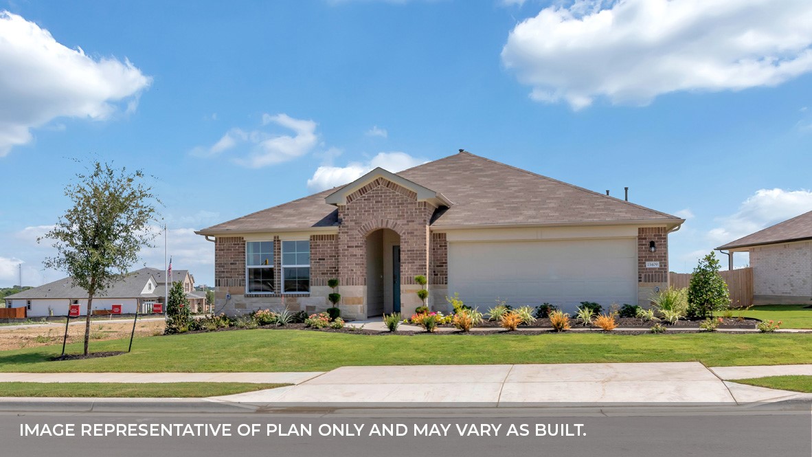 2409 Cattle Baron Trail Leander, TX 78641 - Photo 1 of 1 a front view of house with a garden