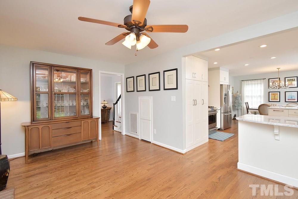 6405 Wrenwood Avenue Raleigh, NC 27607 - Photo 11 of 30 a view of a kitchen with furniture and wooden floor