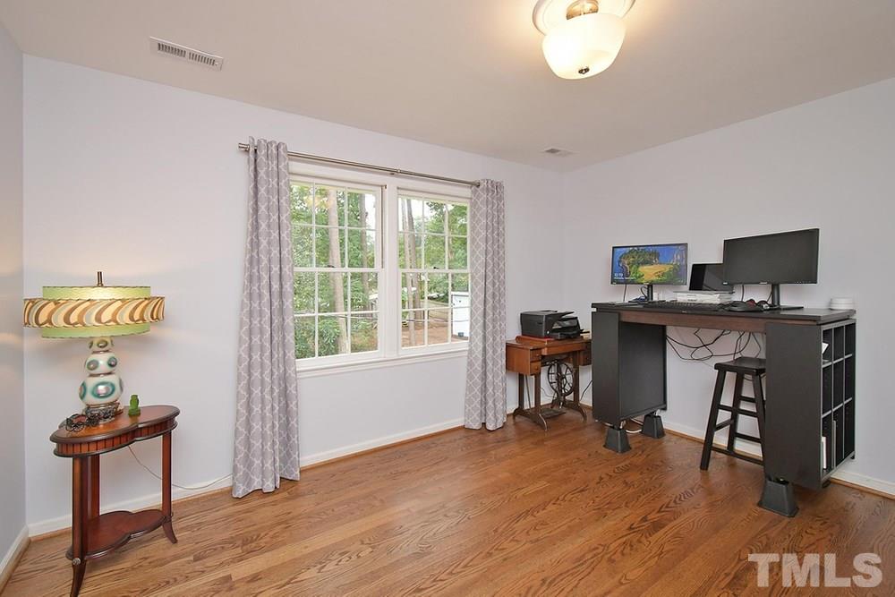 6405 Wrenwood Avenue Raleigh, NC 27607 - Photo 18 of 30 a workspace with furniture hardwood and a window