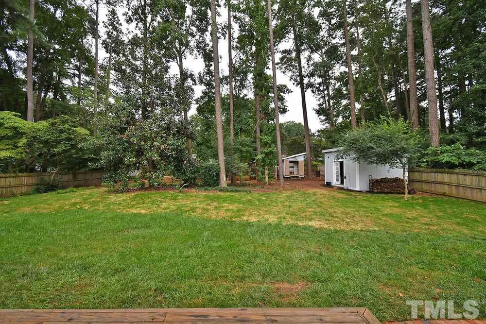 6405 Wrenwood Avenue Raleigh, NC 27607 - Photo 23 of 30 a view of a trees in a yard
