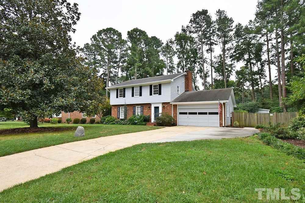 6405 Wrenwood Avenue Raleigh, NC 27607 - Photo 28 of 30 a house view with a garden space