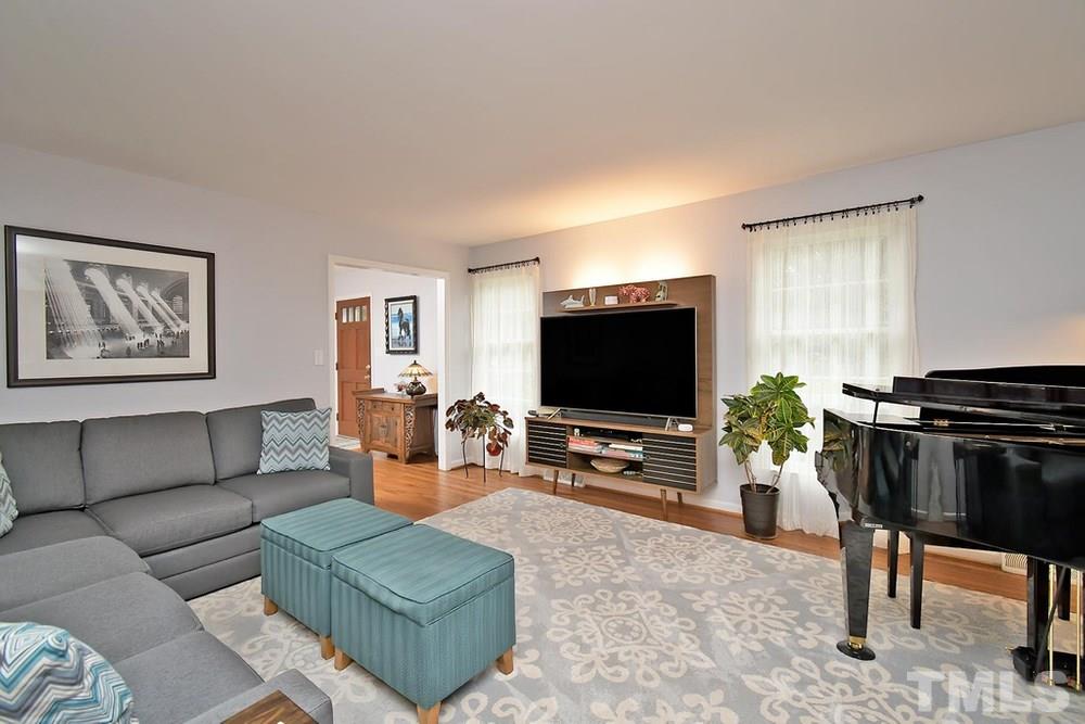 6405 Wrenwood Avenue Raleigh, NC 27607 - Photo 5 of 30 a living room with furniture and a flat screen tv