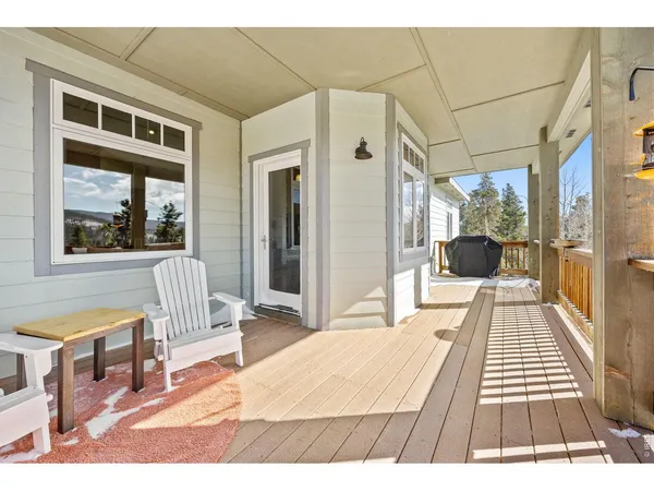 a balcony with view and outdoor seating