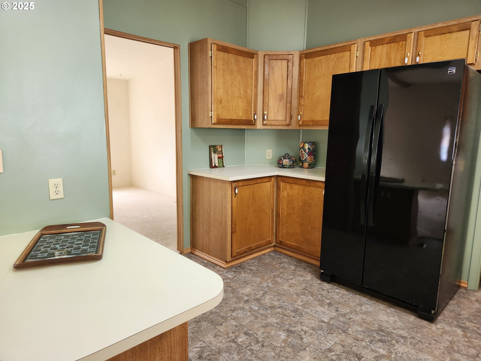 100 River Bend Road, Unit 103 Reedsport, OR 97467 - Photo 11 of 26 a kitchen with stainless steel appliances granite countertop a refrigerator and a stove