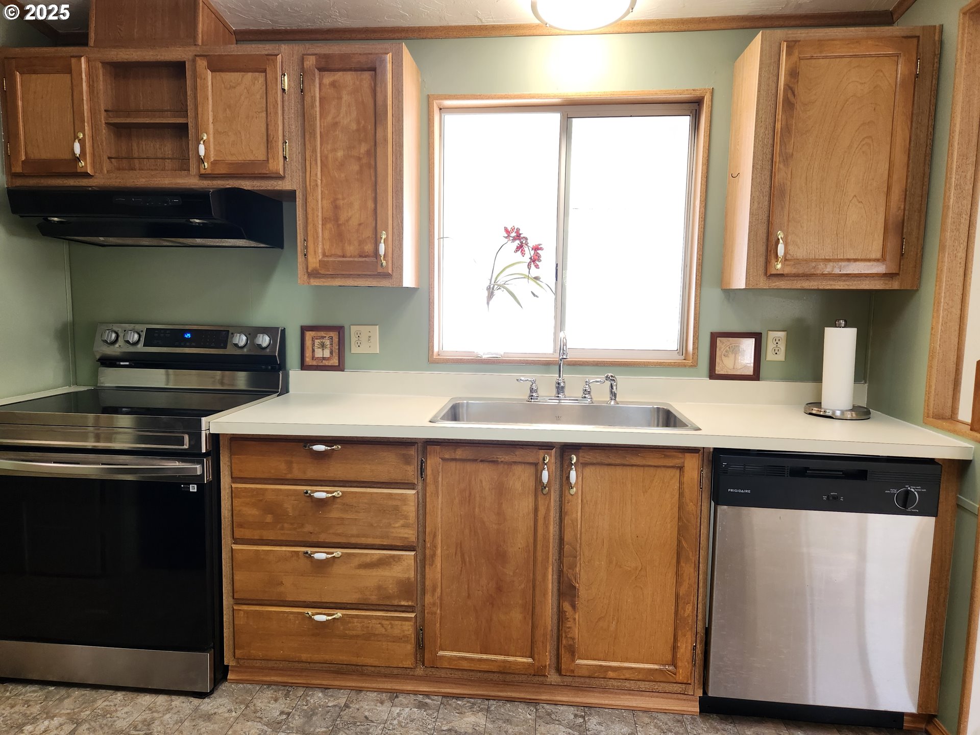 100 River Bend Road, Unit 103 Reedsport, OR 97467 - Photo 12 of 26 a kitchen with stainless steel appliances granite countertop a sink stove and cabinets