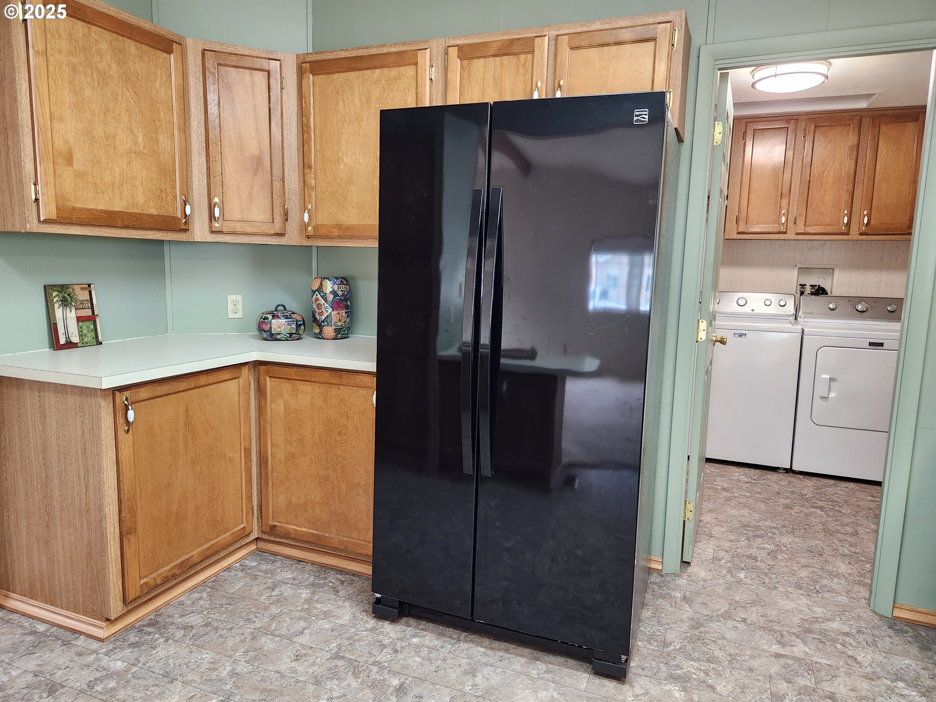 100 River Bend Road, Unit 103 Reedsport, OR 97467 - Photo 13 of 26 a kitchen with stainless steel appliances granite countertop a refrigerator and a stove
