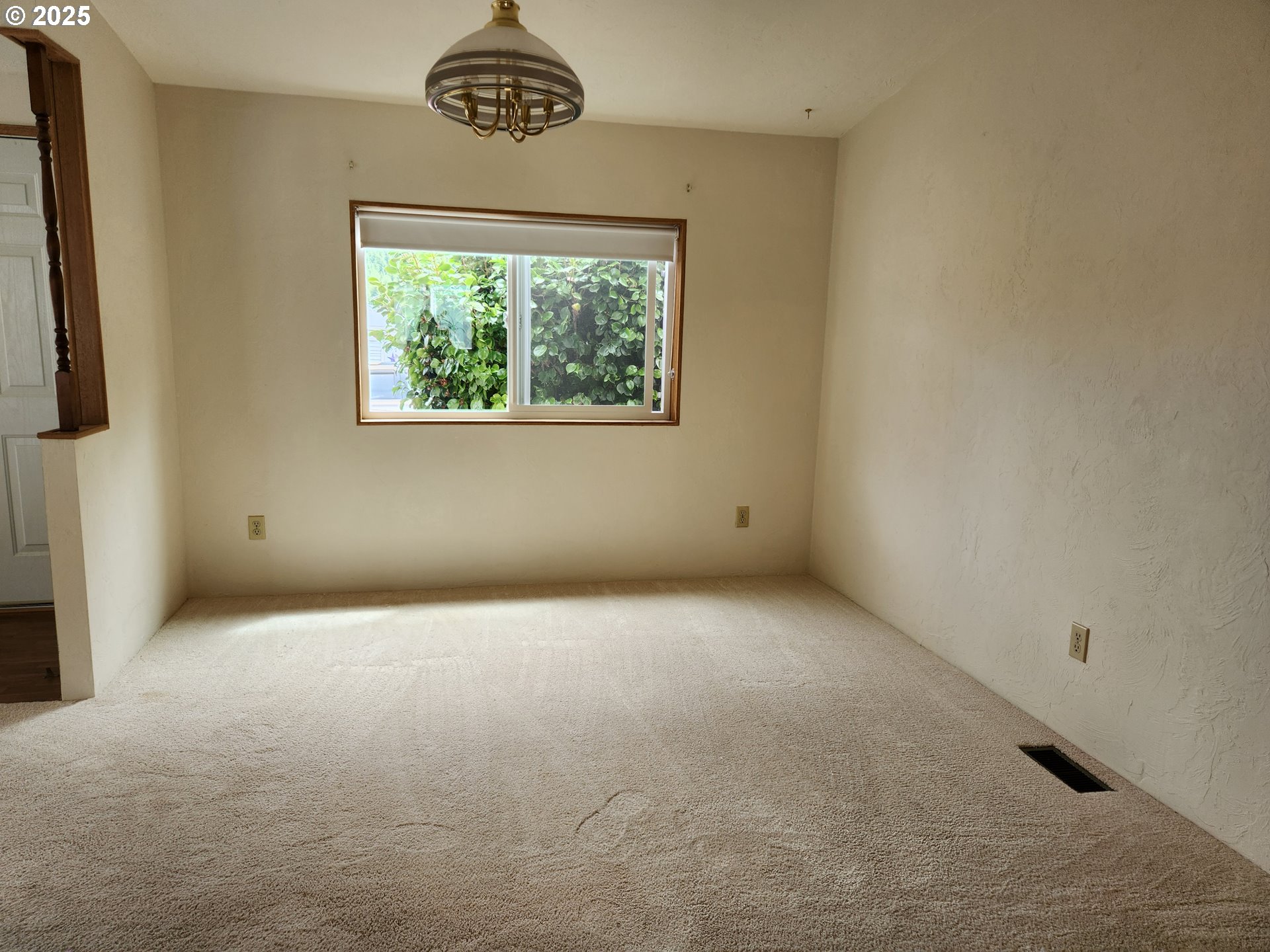 100 River Bend Road, Unit 103 Reedsport, OR 97467 - Photo 14 of 26 an empty room with a window