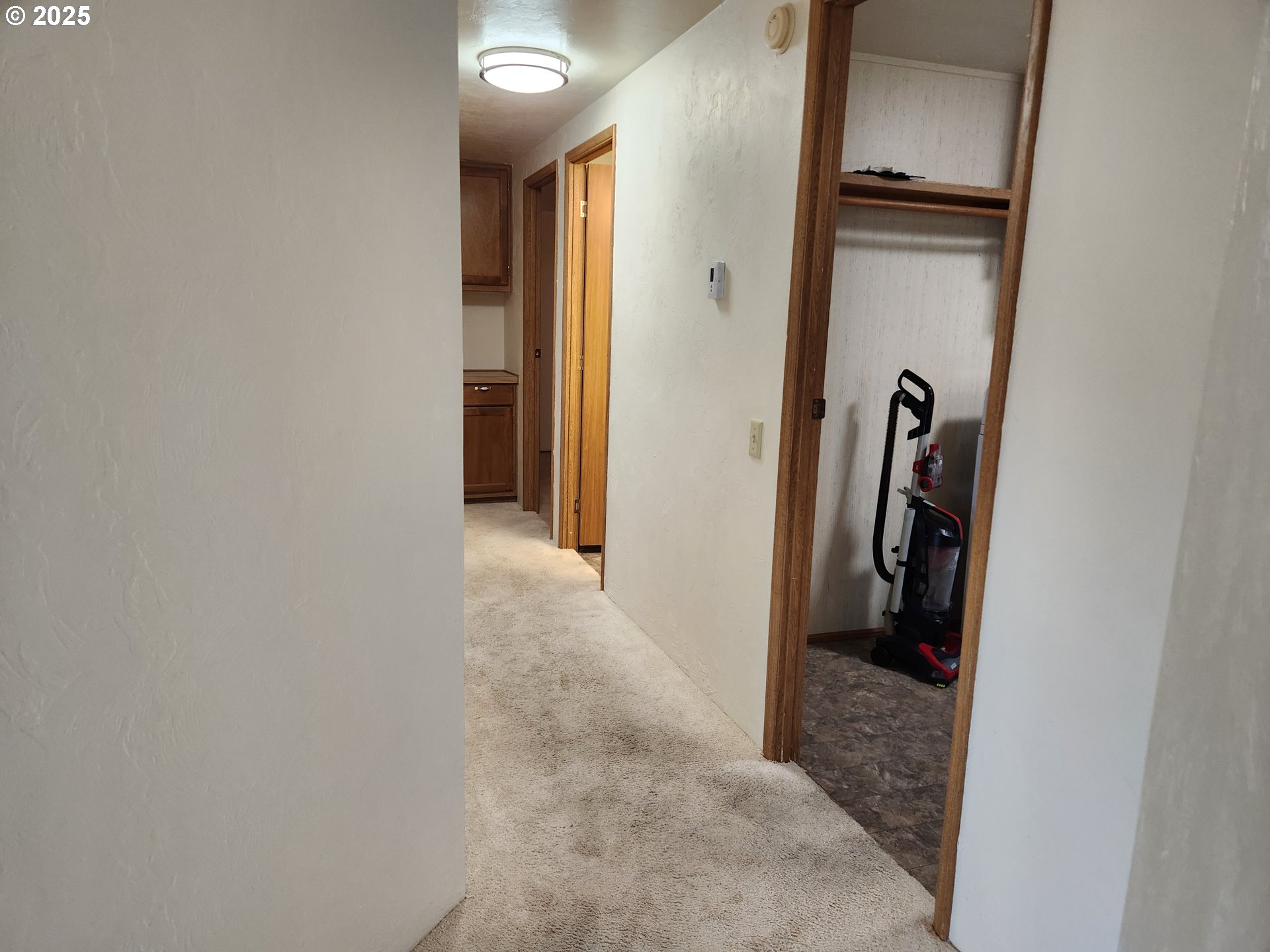 100 River Bend Road, Unit 103 Reedsport, OR 97467 - Photo 15 of 26 a view of a hallway with a room