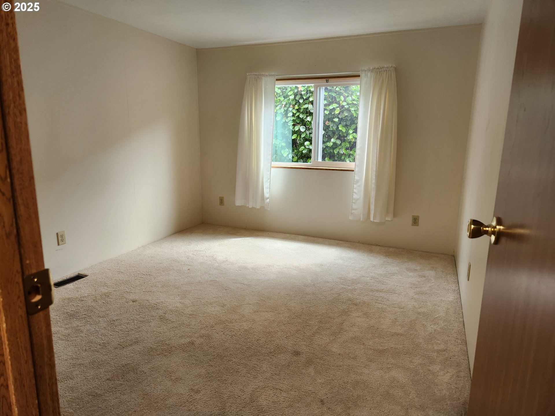 100 River Bend Road, Unit 103 Reedsport, OR 97467 - Photo 18 of 26 an empty room with windows