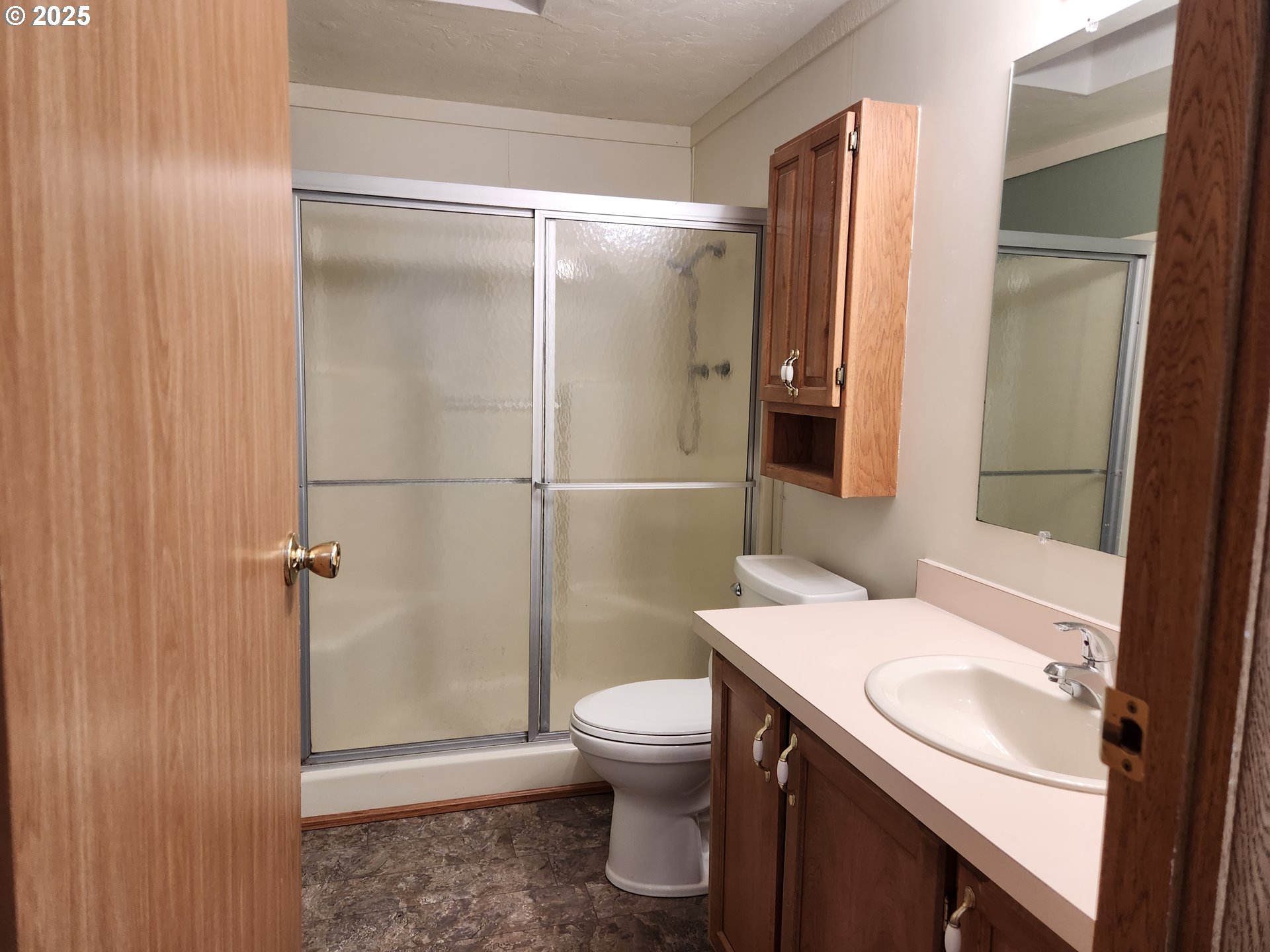 100 River Bend Road, Unit 103 Reedsport, OR 97467 - Photo 19 of 26 a bathroom with a sink a toilet and shower