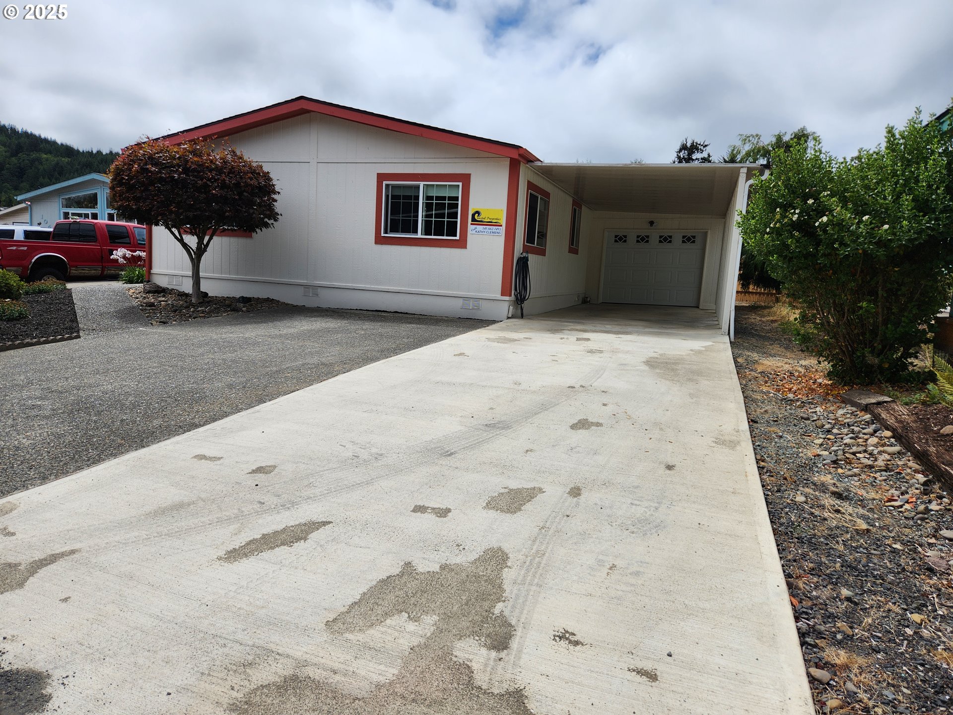 100 River Bend Road, Unit 103 Reedsport, OR 97467 - Photo 2 of 26 a view of a house with a backyard
