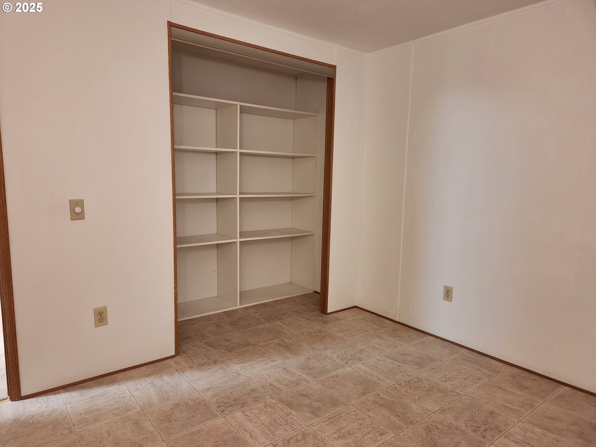 100 River Bend Road, Unit 103 Reedsport, OR 97467 - Photo 21 of 26 a view of an empty room with a closet