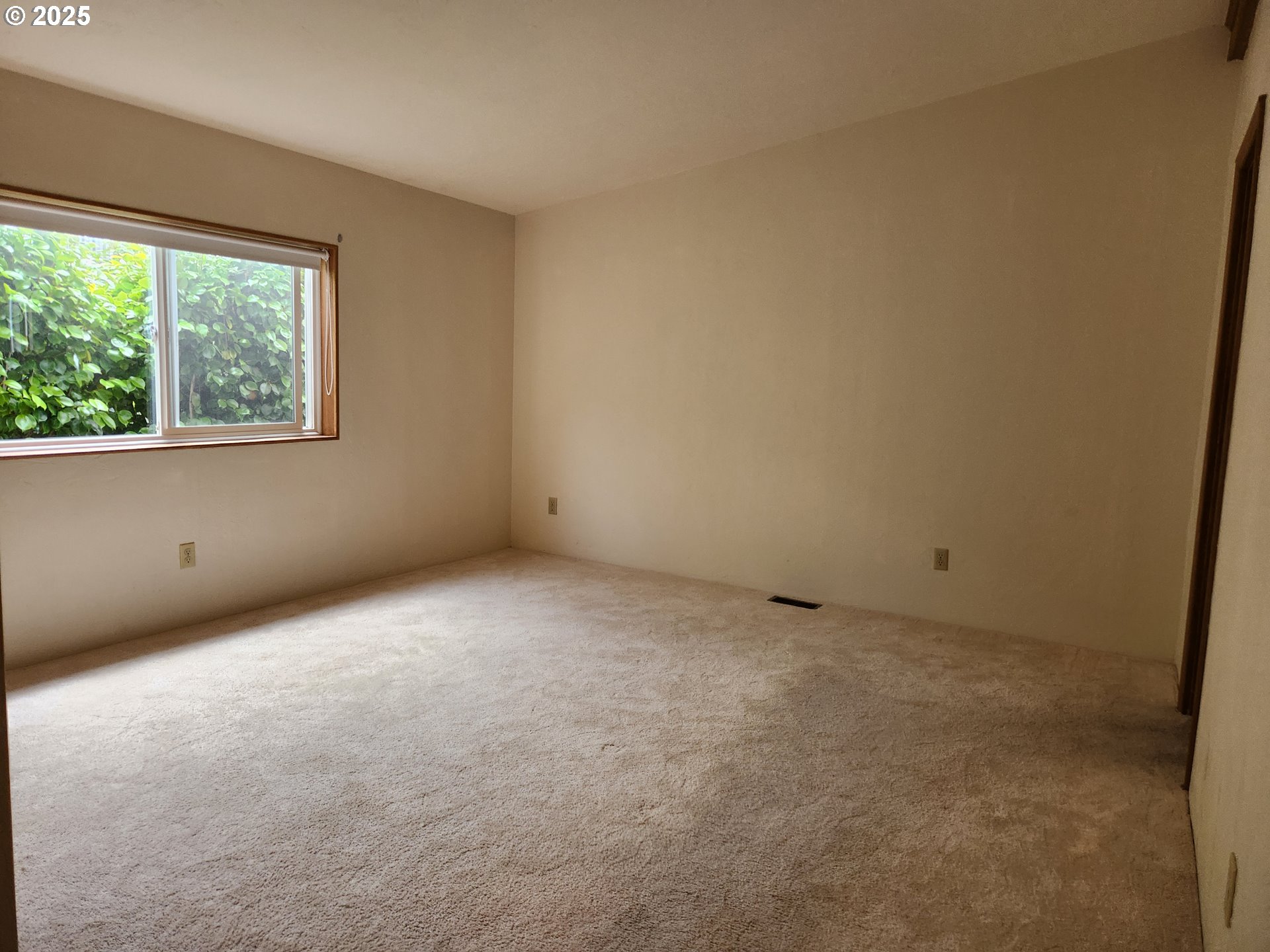 100 River Bend Road, Unit 103 Reedsport, OR 97467 - Photo 22 of 26 an empty room with a window