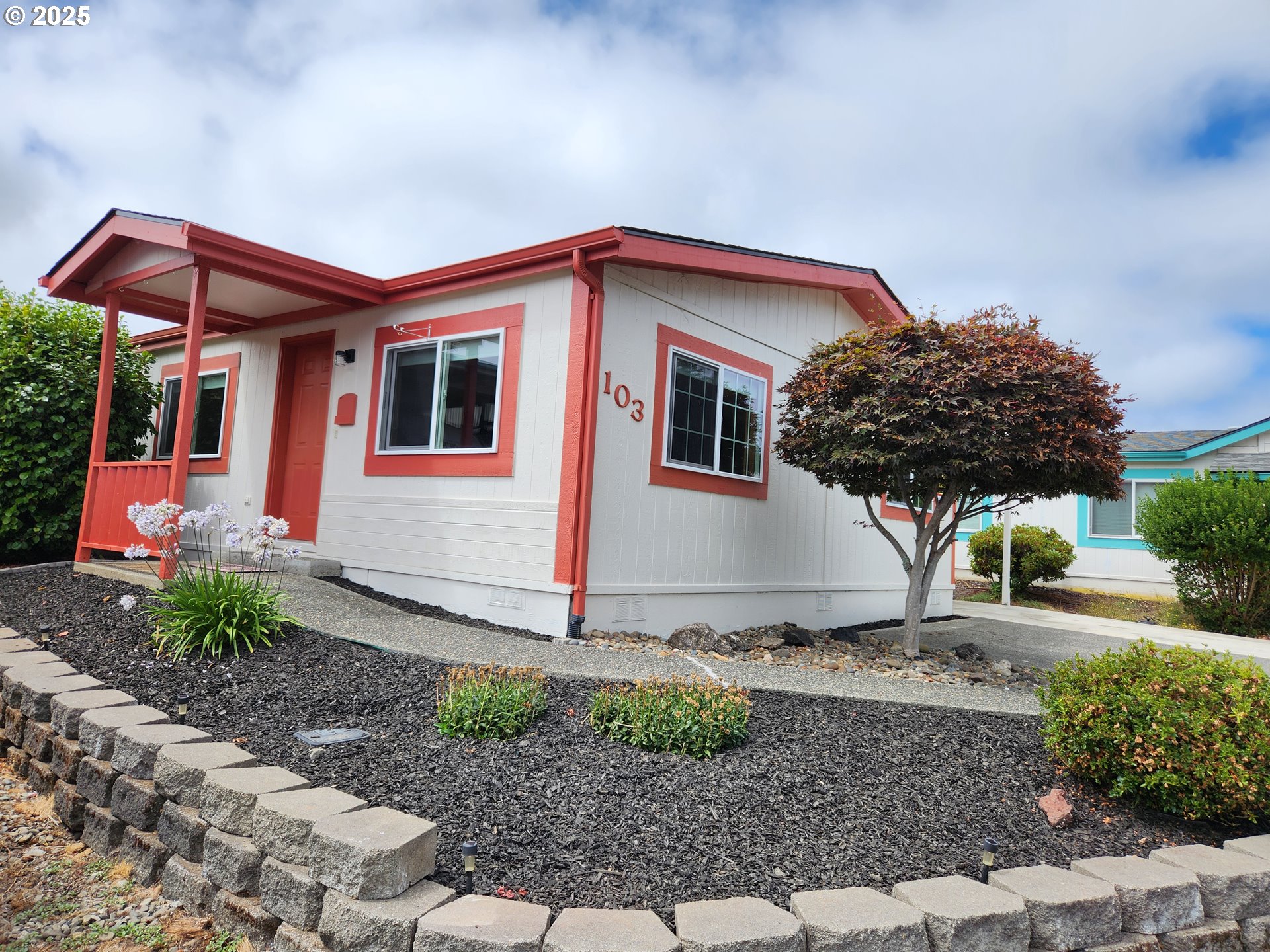 100 River Bend Road, Unit 103 Reedsport, OR 97467 - Photo 3 of 26 a house view with a backyard space
