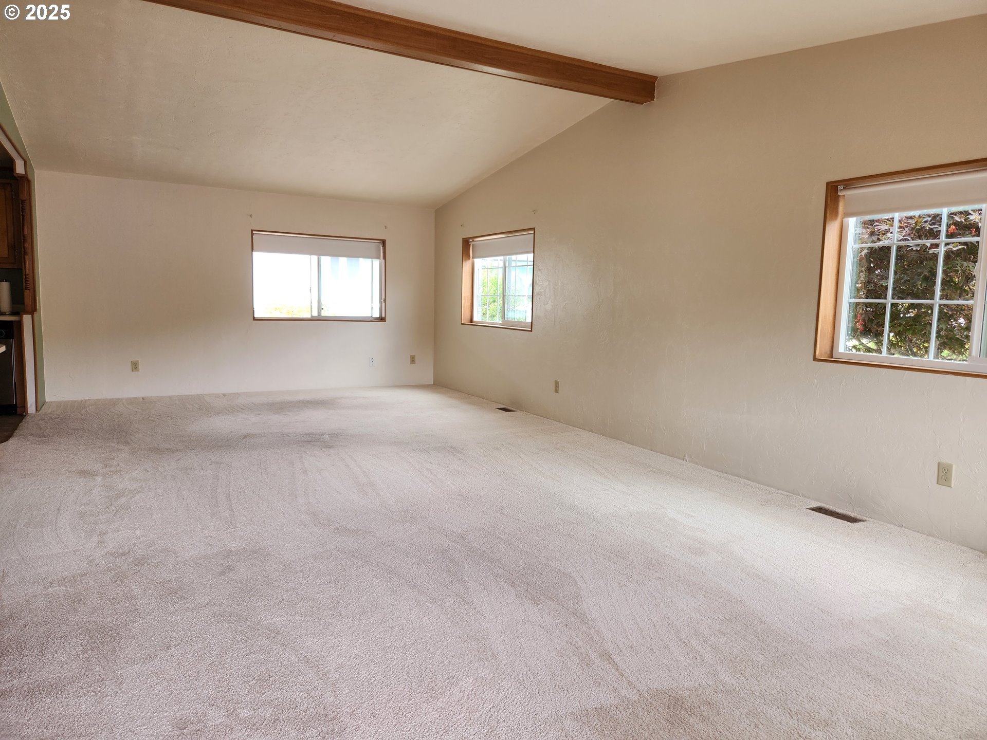 100 River Bend Road, Unit 103 Reedsport, OR 97467 - Photo 8 of 26 an empty room with windows