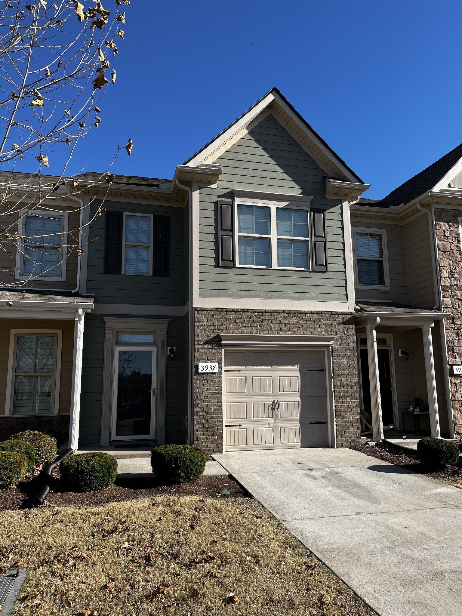 a front view of a house with a yard