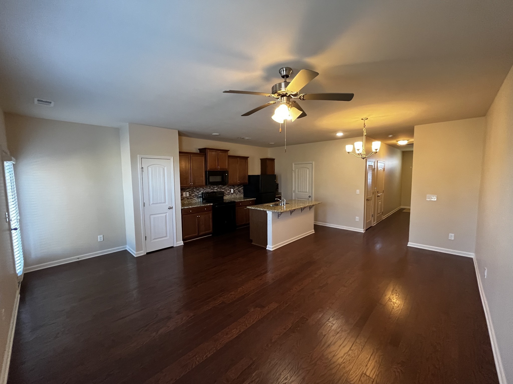 3937 Cannonsgate Lane Murfreesboro, TN 37128 - Photo 3 of 14 a view of a kitchen with a sink and a stove top oven