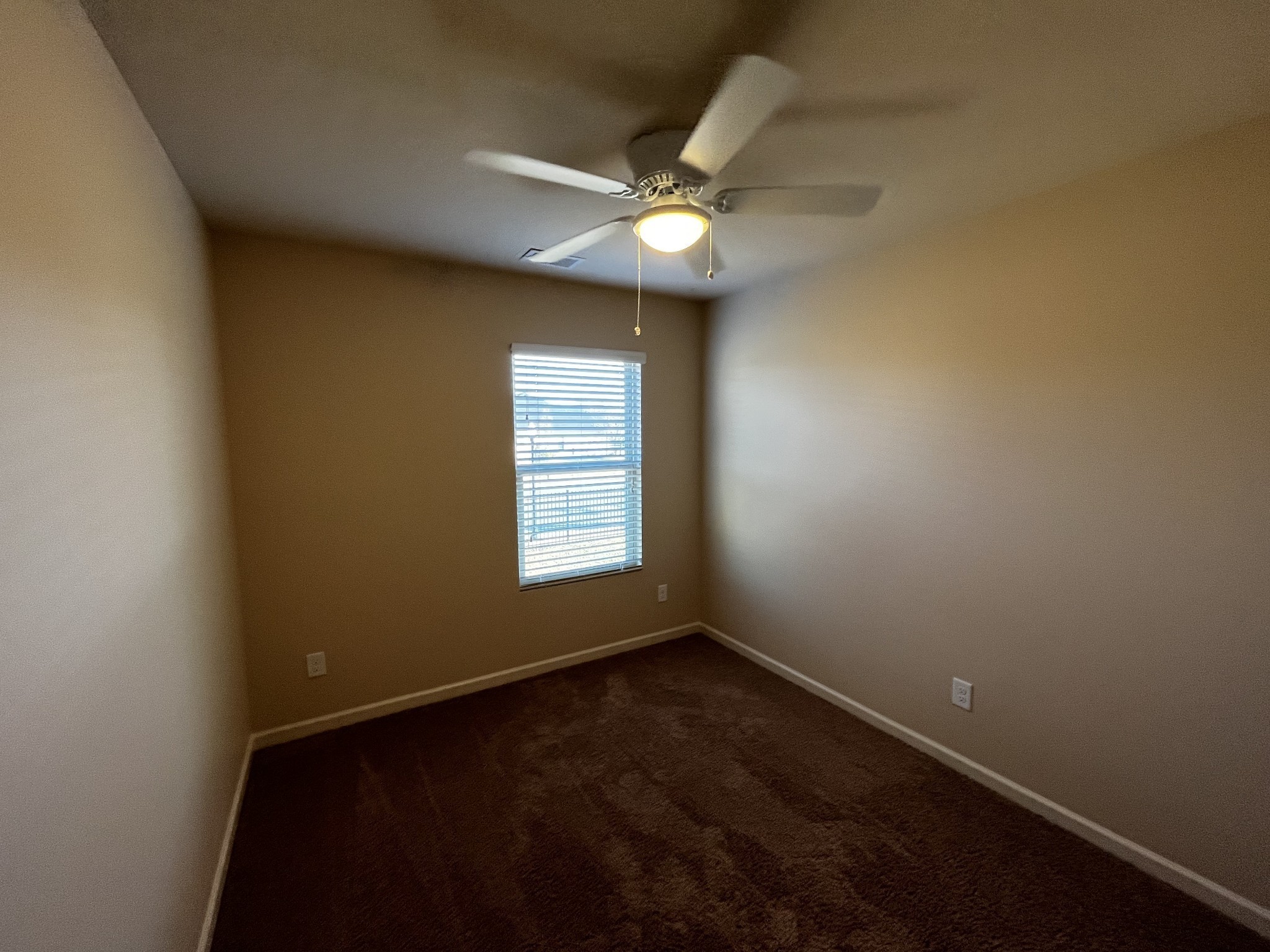 3937 Cannonsgate Lane Murfreesboro, TN 37128 - Photo 6 of 14 an empty room with a window and a fan