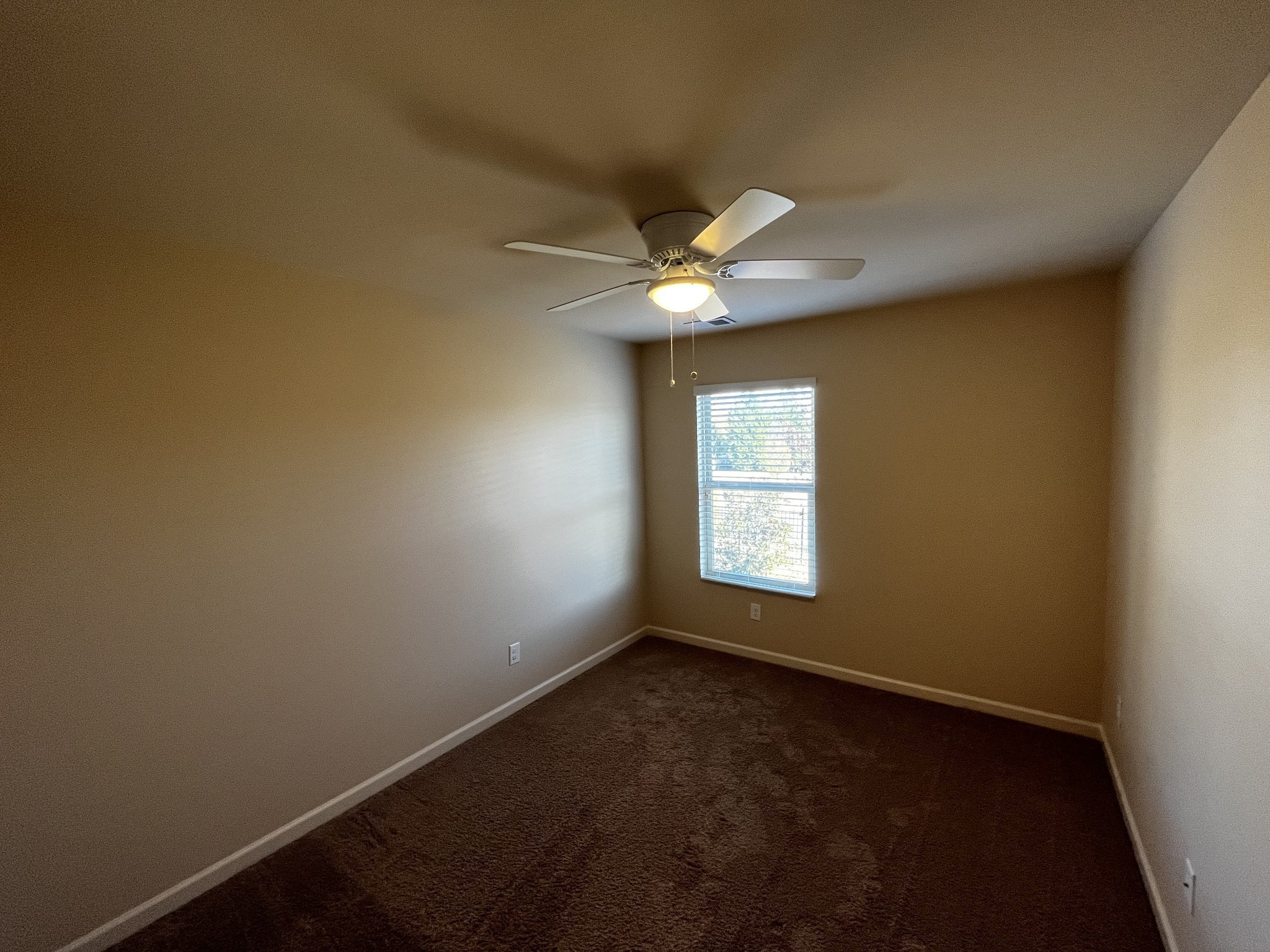 3937 Cannonsgate Lane Murfreesboro, TN 37128 - Photo 7 of 14 an empty room with windows and fan