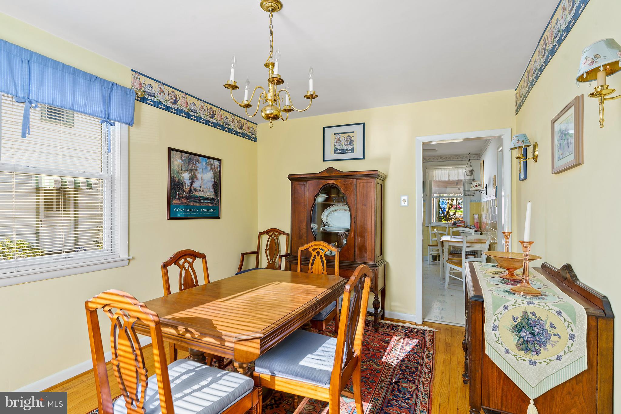 13 Golf Road Darby, PA 19023 - Photo 7 of 24 a view of a dining room with furniture a chandelier and wooden floor