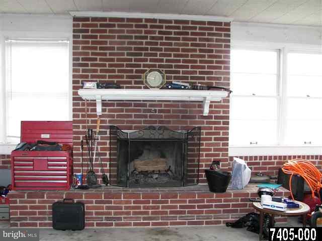 21 South Biesecker Road York, PA 17408 - Photo 12 of 18 a kitchen with a fireplace and a window