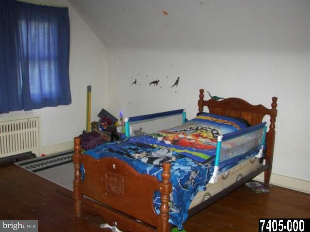 21 South Biesecker Road York, PA 17408 - Photo 6 of 18 a bedroom with a bed and wooden floor
