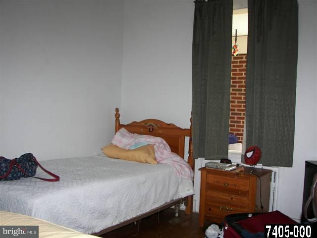 21 South Biesecker Road York, PA 17408 - Photo 9 of 18 a bedroom with a bed and a chandelier