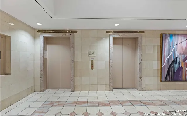 a bathroom with a shower and a sink