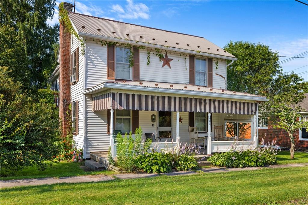 777 Main Street Addison, PA 15411 - Photo 1 of 35 front view of a house with a yard