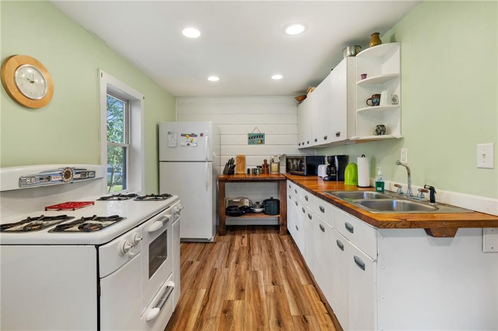 777 Main Street Addison, PA 15411 - Photo 12 of 35 a kitchen with stainless steel appliances granite countertop a stove and a refrigerator