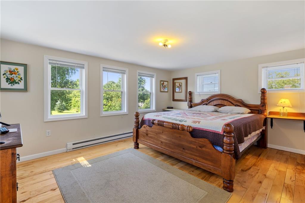 777 Main Street Addison, PA 15411 - Photo 16 of 35 a bedroom with a bed and lamp next to a window