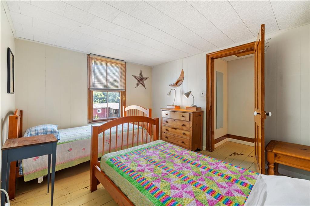 777 Main Street Addison, PA 15411 - Photo 19 of 35 a bedroom with a bed and a dresser in it