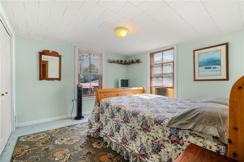 777 Main Street Addison, PA 15411 - Photo 20 of 35 a bed sitting in a bedroom next to a window