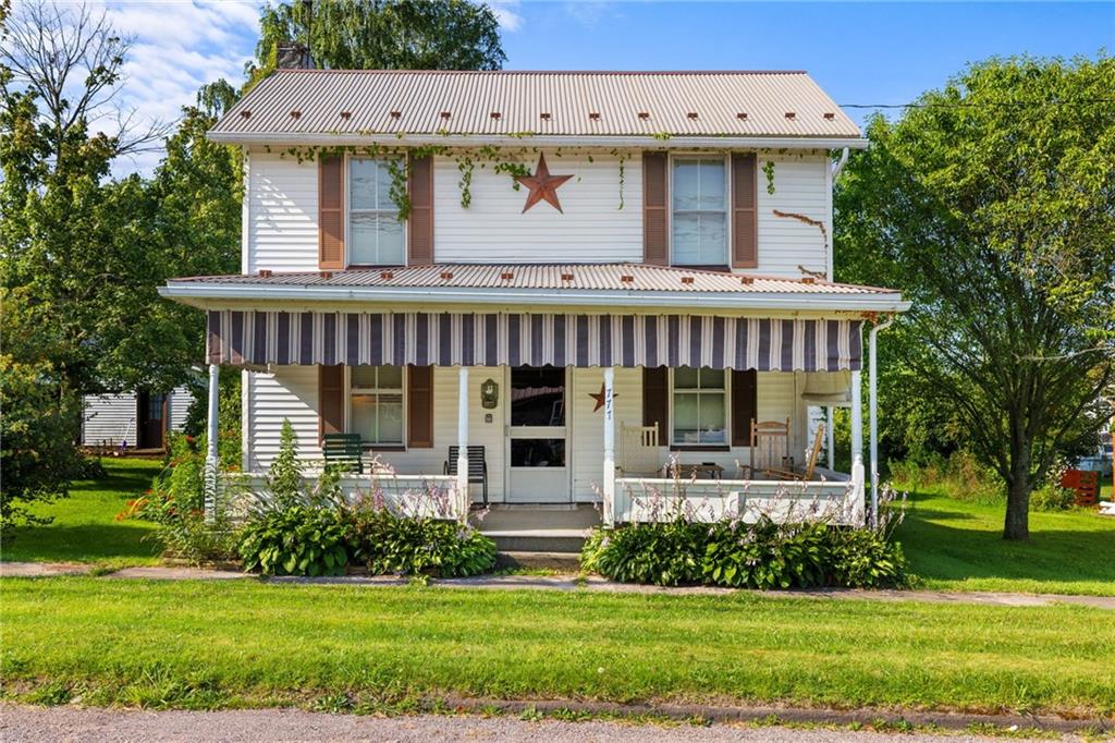 777 Main Street Addison, PA 15411 - Photo 2 of 35 a front view of a house with a yard